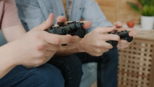 Close Up on Friends Playing Video Games Indoors