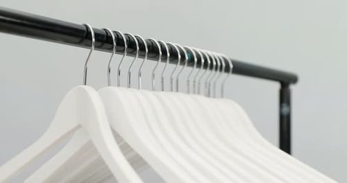 Hangers arranged on clothes rack 4K 4k