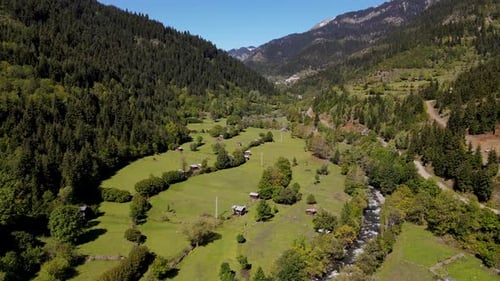 Idyllic Mountain Valley with Lush Green Landscape