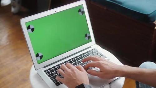 Closeup of Hipster Freelancer Male Hands Using Green Screen Chroma Key Laptop Typing Working in