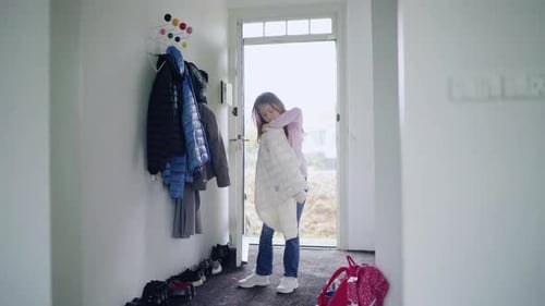 Girl in entrance hall