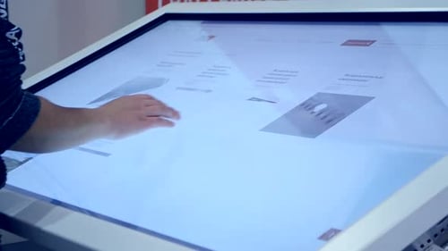 Girl Moves Drawing with Her Fingers on the Big Touch Screen