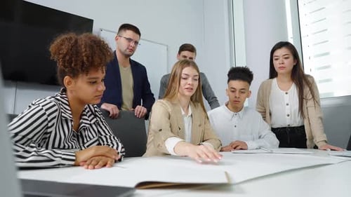 Architects Discussing Masterplan at Meeting in Office