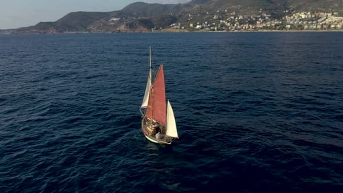 Sailing Yacht Sails to Sea Aerial View 4 K