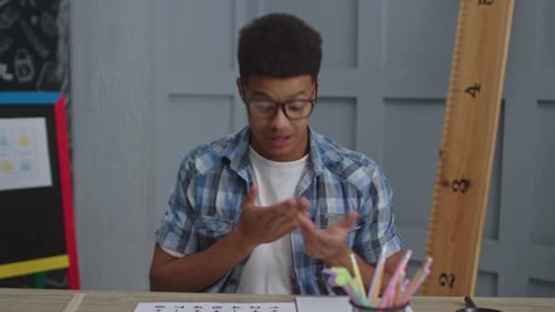 Young Adult Explaining a Concept in Classroom