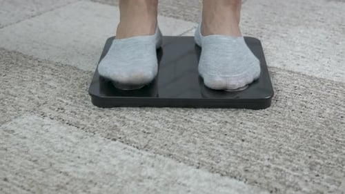 Feet on Scale with Measuring Tape