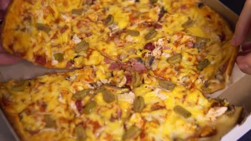 Close Up of Pizza with Slice Taken Out