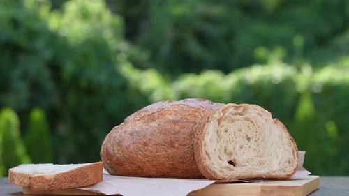 Fresh Bread Loaf on a Wooden Cutting Board