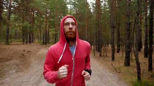 Man Running in Forest Woods Training.