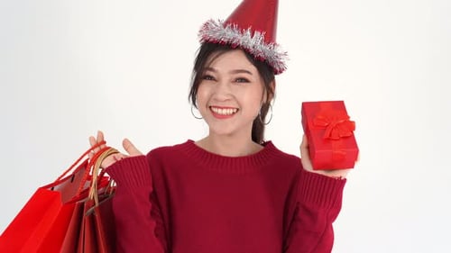 Excited Woman Holding Gifts and Shopping Bags