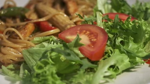 Delicious Plate of Noodles and Fresh Salad
