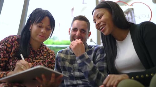 Friends Collaborate and Laugh using Tablet Technology