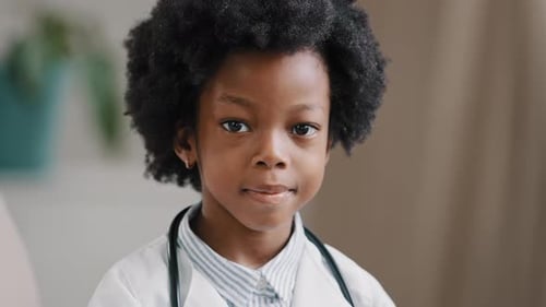 Young Child Doctor Smiling Wearing Stethoscope Indoors