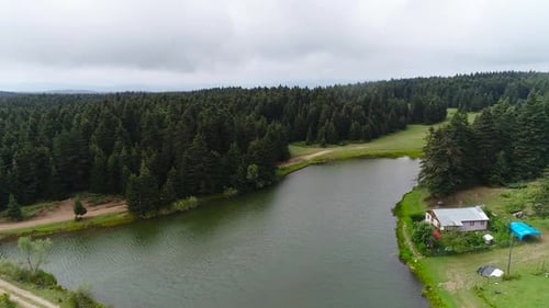 Lake and lakeside house in the forest.
