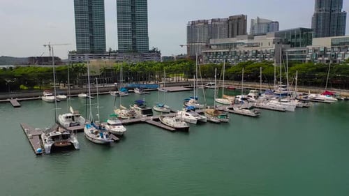 Boats docked at a Marina in an Urban Setting
