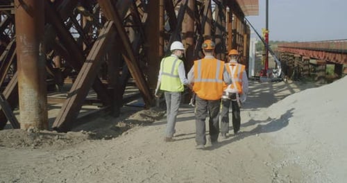 Inspectors Walking on Bridge Construction Site