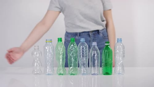 Plastic Bottles Pushed Out of View for Recycling