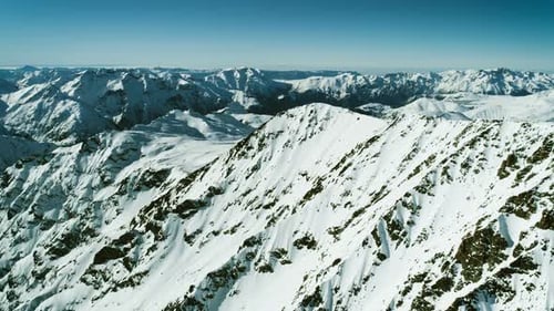 Aerial View of Snow Covered Mountain Range