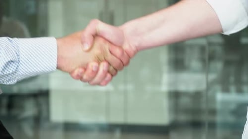 Close Up Two Men Shake Hands Conclude Successful Contract Agreement Sign of Support for Partnership