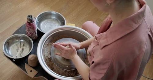 Artist Shaping Clay on a Pottery Wheel