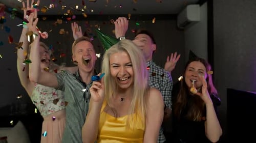 Joyful Friends Celebrate Birthday Party with Confetti