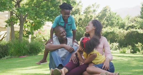 African American family spending time in the garden together