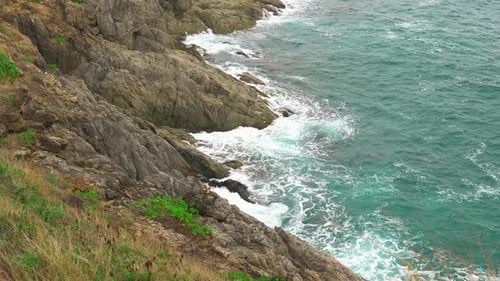 Turquoise Sea Water. the Waves Beat Against the Stone Shore. Dramatic View
