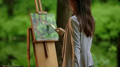 Woman Painting Forest Landscape on Canvas Easel