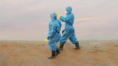 Environmentalists Walking Along Polluted Pond