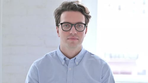 Man Smiling Giving Thumbs Up Indoors