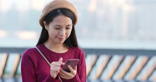 Woman Use of Mobile Phone in City