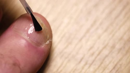 Toe Nail Treatment Applied with Brush Applicator