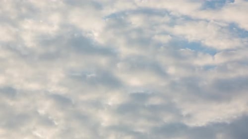 Fluffy White Clouds Moving Across the Sky