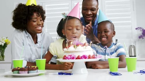 Family Celebrates Birthday Together in Kitchen