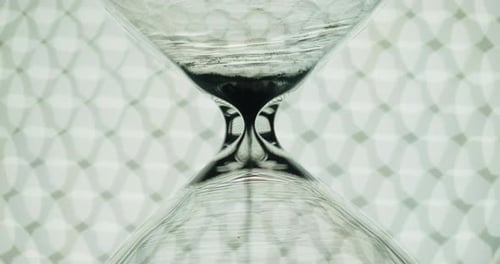 Liquid Hourglass with Abstract Background