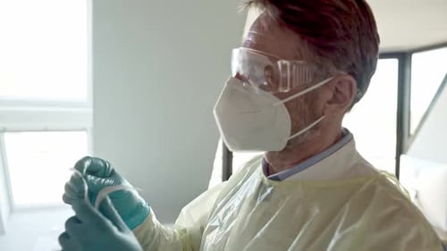 Medical Worker Administers Nasal Swab in Hospital