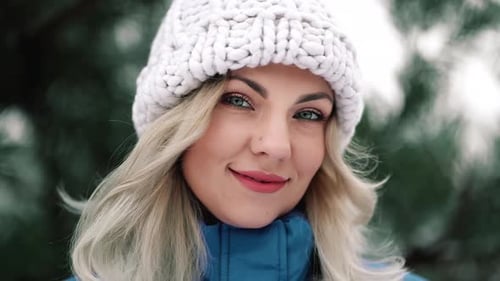 Portrait of Young Pretty Woman in Forest Winter Season