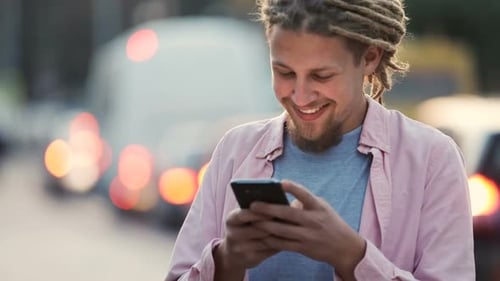 Man Texts in Street