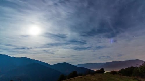 Mountain Range Illuminated by the Moon at Night