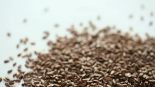 Flax Seeds Close Up on a White Background