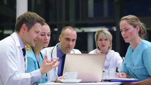 Medical Team Collaborates at Modern Hospital Meeting
