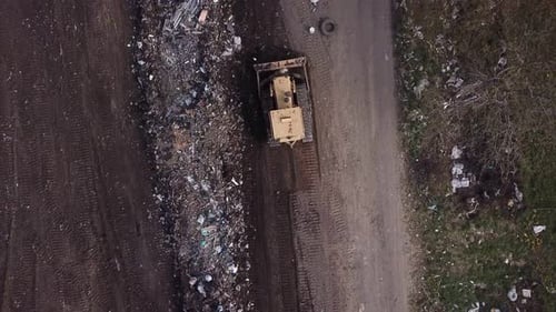 Aerial Shot of Bulldozer Working at Landfill