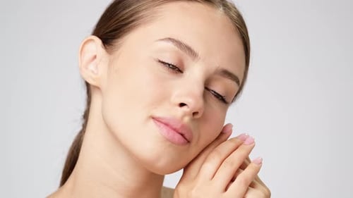 Beautiful Young Woman Posing in Studio Close Up