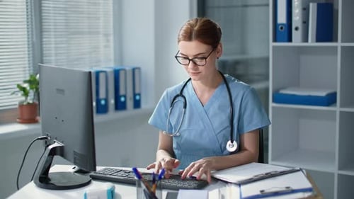 Woman Doctor Working at Her Desk