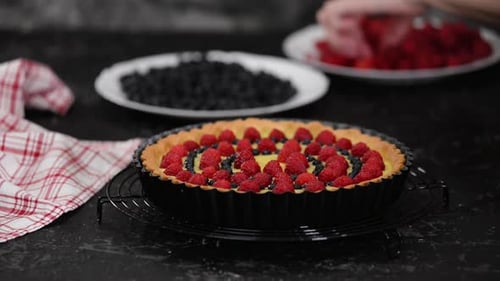 Woman Making Custard Tart with Berries. Tart with Berries.