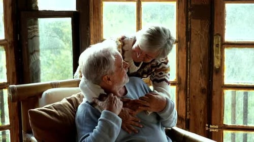 Loving Senior Couple Embracing Indoors