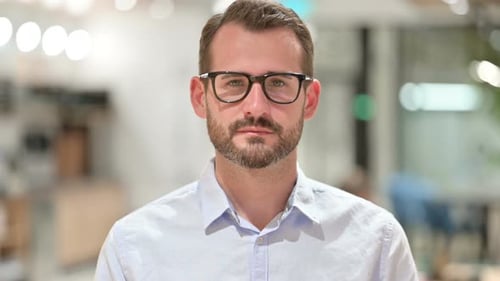 Man Looking at Camera in the Office