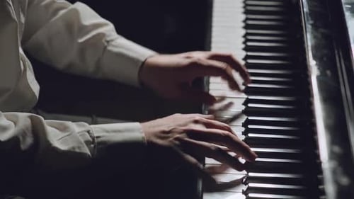 The Pianist Performs Playing a Grand Piano