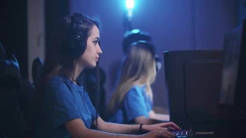 Group of Friends Sitting in the Gaming Club By Computers