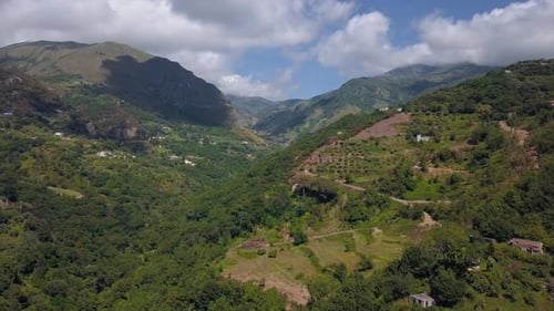 Aerial Mountain Gorge Hills Covered with Forest. Beautiful Mountain Landscape Sunny Weather in Italy